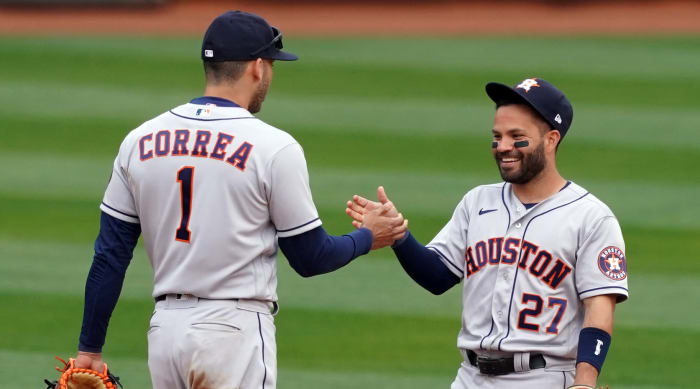 Carlos Correa and Jose Altuve celebrate a win over the A's